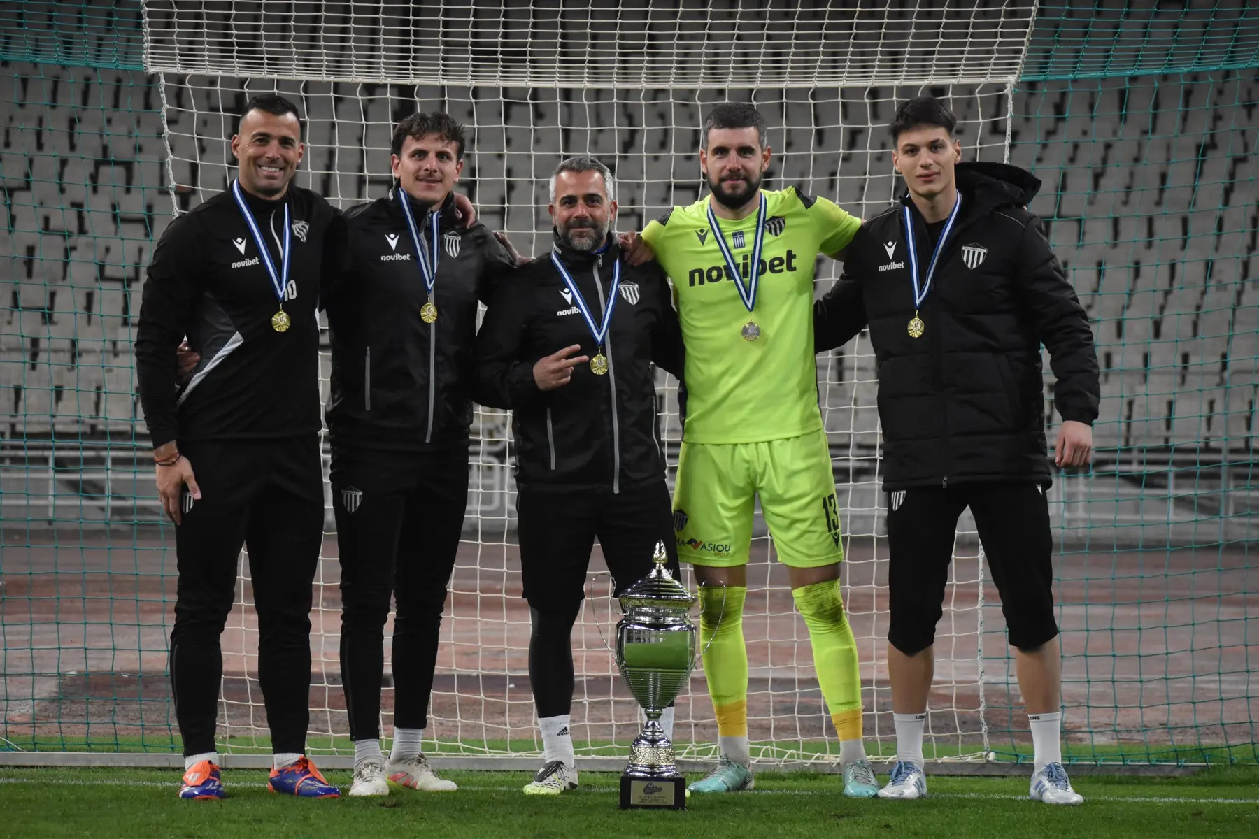 Giannis Gelios in the number 13 goalkeeper shirt with Panagiotis Pomonis and Kalamata F.C.